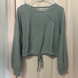 Green open back shirt
